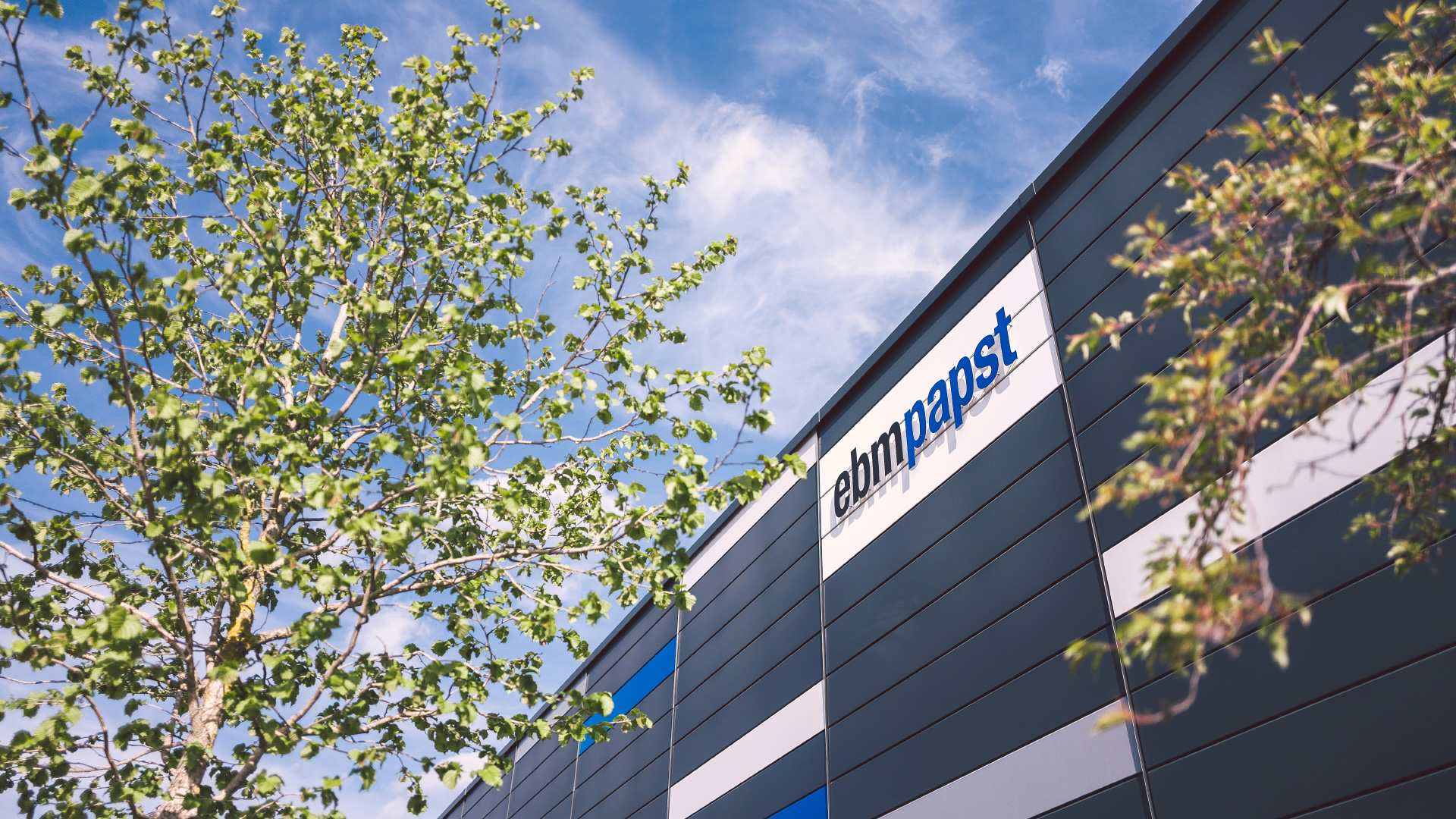 Decorative lettering displaying ebm-papst logo at a corporate building