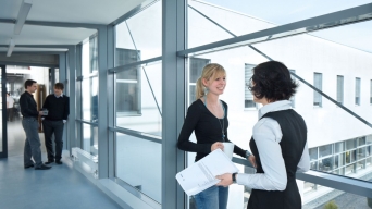 ebm-papst's employees having a conversation in the company's hallway