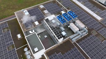 Aerial view of an industrial rooftop featuring  a central HVAC system