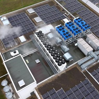Aerial view of an industrial rooftop featuring  a central HVAC system